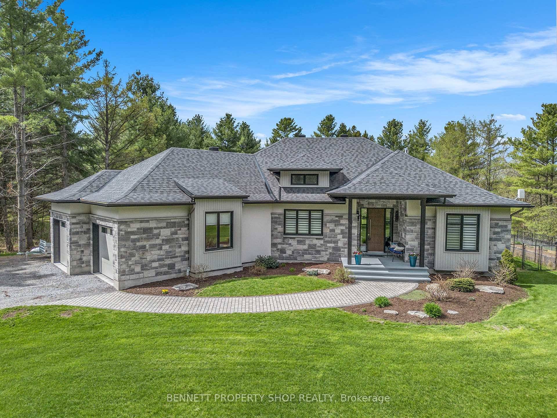 Discover unparalleled luxury and serenity at this breathtaking 5 bedroom, 3 bathroom walkout estate, nestled on 4 pristine acres along the tranquil banks of Becketts Creek, just 12 minutes from ...