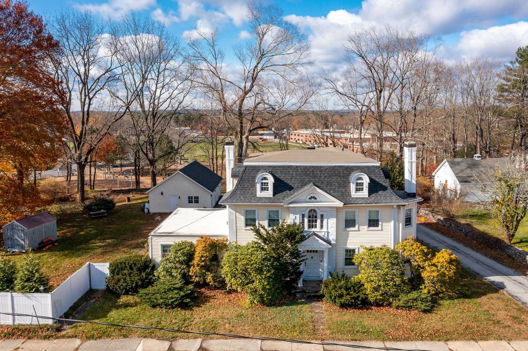 Discover timeless charm and modern convenience in this stately Victorian multi family at 409 Main Street in Killingly, a rare find in the coveted North Main Street Historic District.