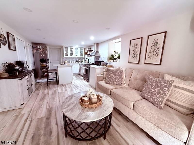 1 Block away from train station 15 minutes away from Hoboken NYC, Modern kitchen with quarzt countertops, stainles steel appliances.