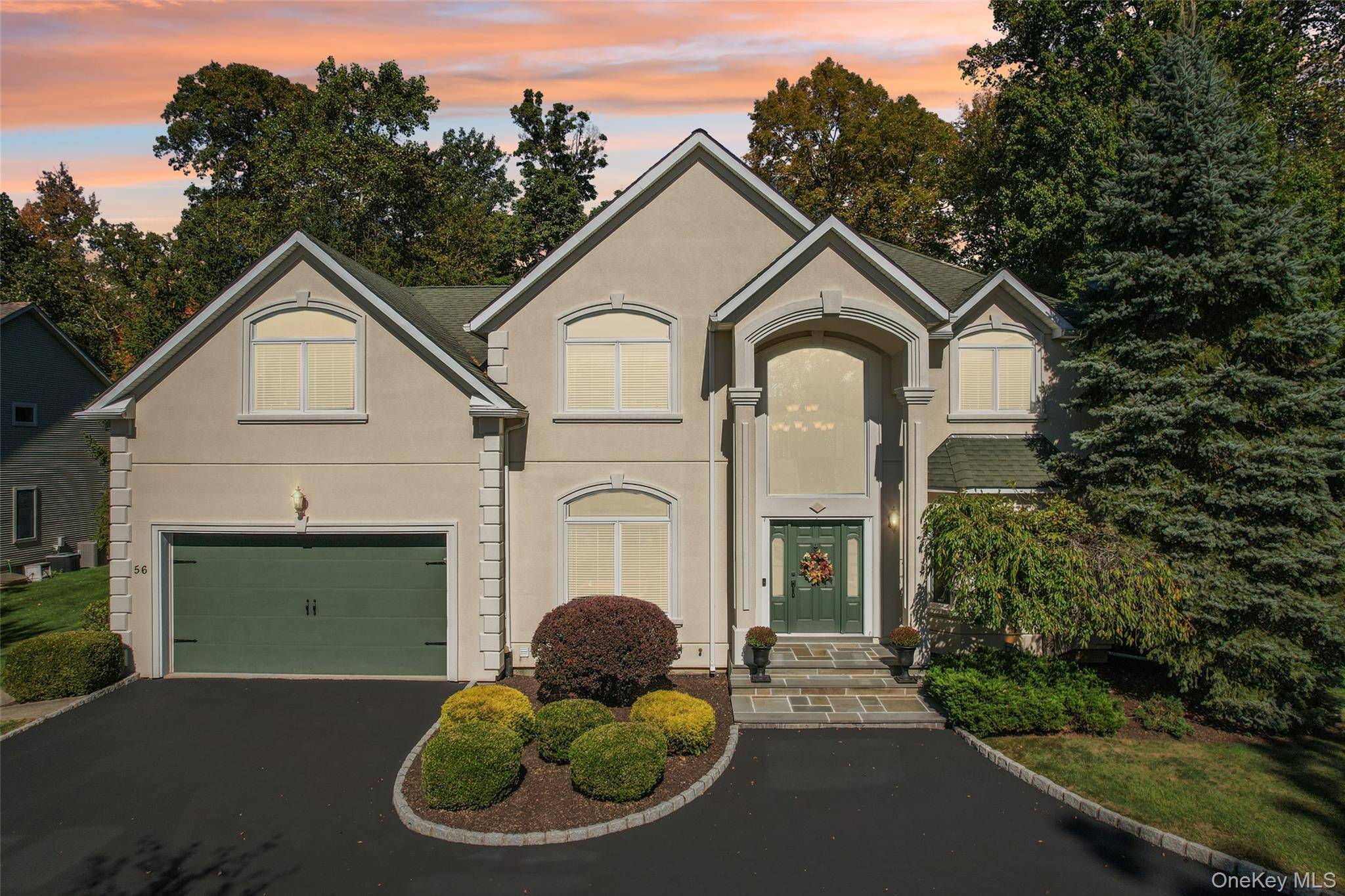 Welcome to 56 Greenwich Avenue, an architectural masterpiece nestled in the exclusive community of The Greens of Woodbury.