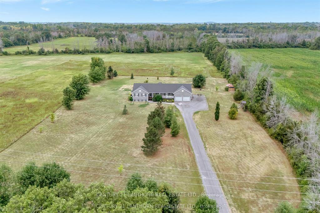 Welcome to 1489 Airport Rd, a beautifully maintained all brick home built in 2003, set on approximately 6.