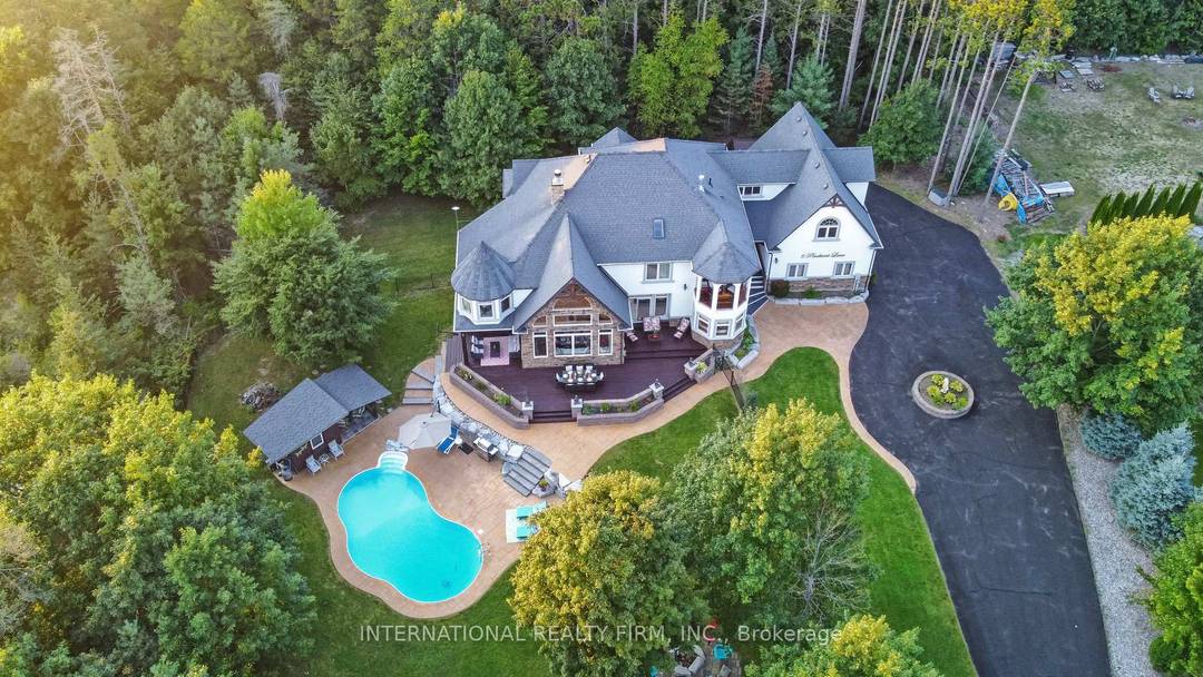 Experience the ultimate retreat in this stunning custom built estate, perfectly positioned on a private 1.