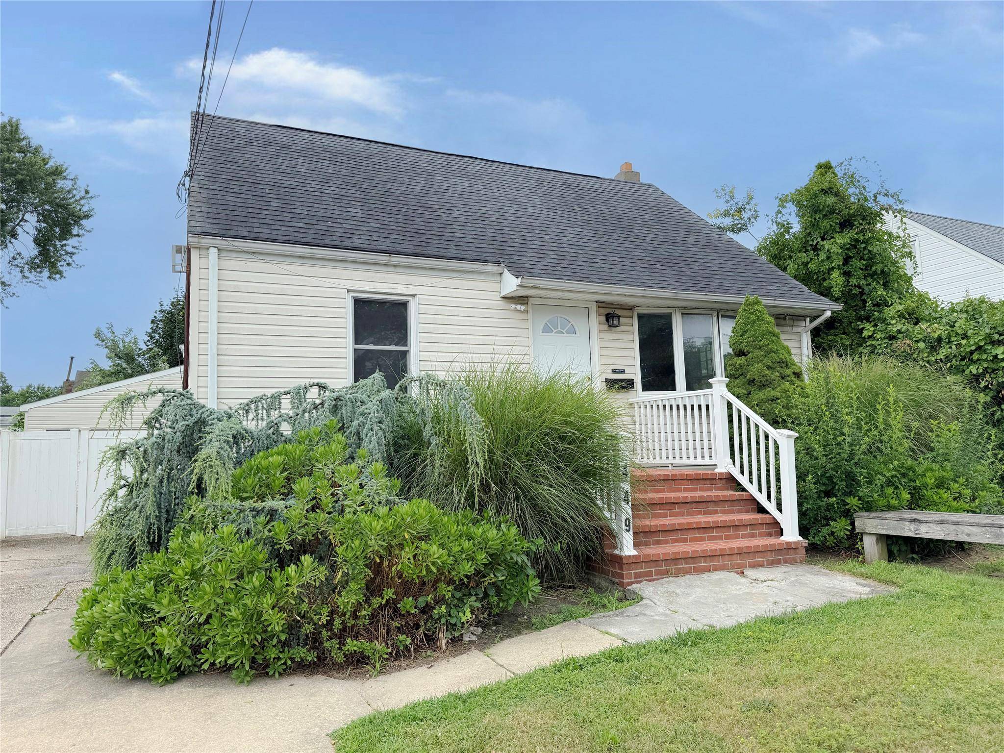 Spacious 3 bedroom 2 bath cape in the village of Lindenhurst.