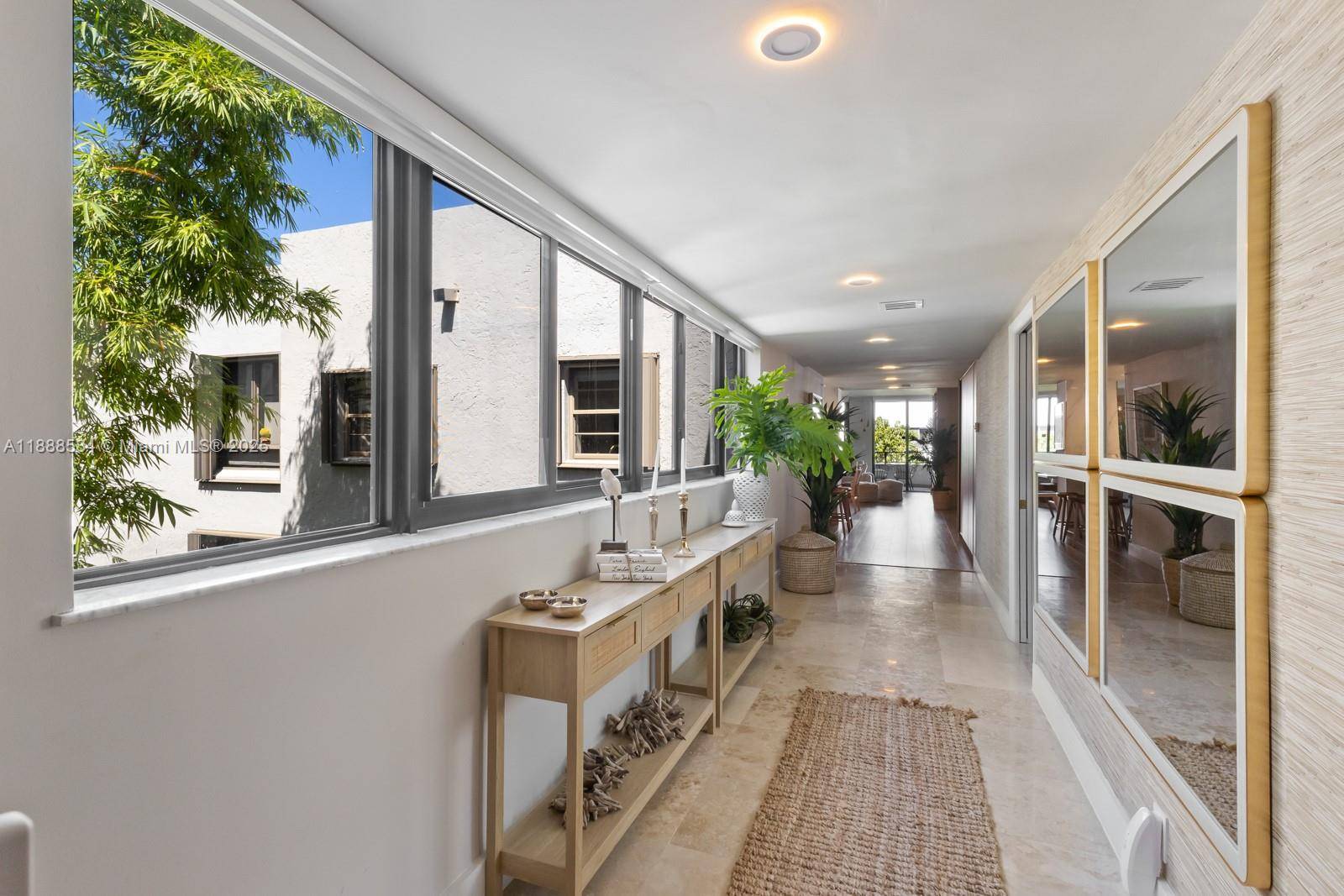 SPECTACULAR FULLY REMODELED 4 BED 2 BATH PENTHOUSE IN BOTANICA AT KEY COLONY, A BEACHFRONT GATED COMMUNITY IN KEY BISCAYNE.