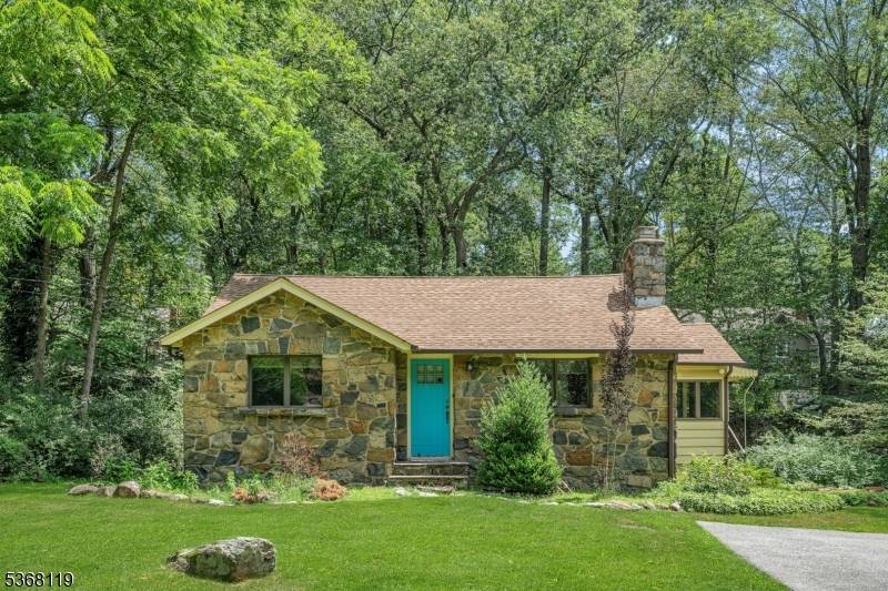 Cozy and convenient 1 floor living overlooking private backyard with babbling brook near Lake Valhalla.