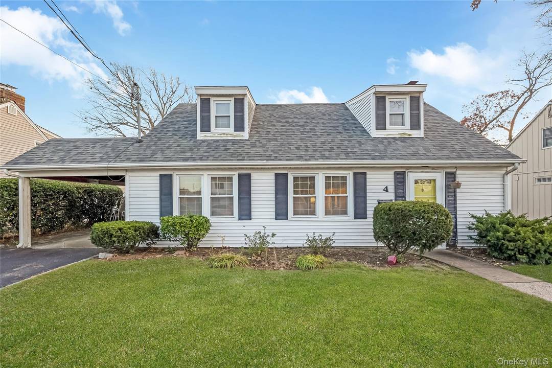 Dormered Cape Cod with 4 Bedrooms and 2 Baths.