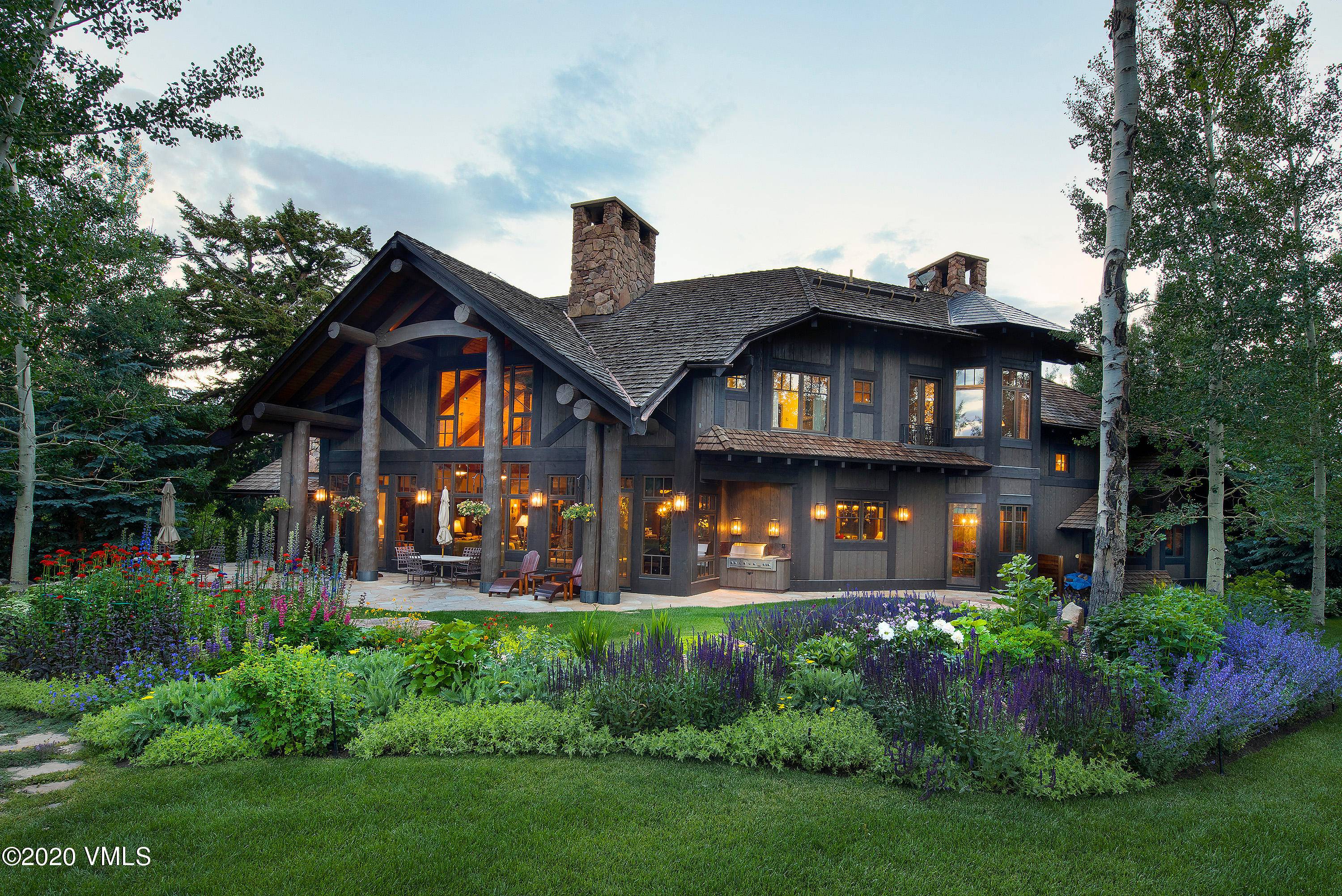 Extraordinary 6 bedroom mountain lodge including a private guest cabin with a full kitchen connected by enclosed bridge.