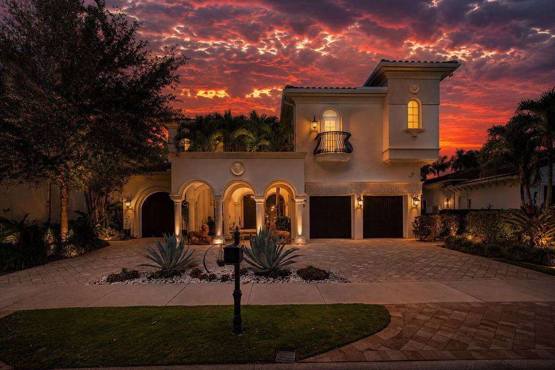 Stunning estate home with spectacular golf course views, ideally situated within the prestigious Golf Estates of Old Palm Golf Club.