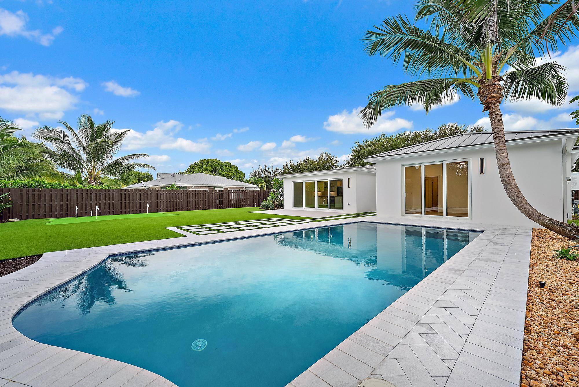 Welcome to 439 Lighthouse Dr, a completely reimagined coastal retreat in North Palm Beach.