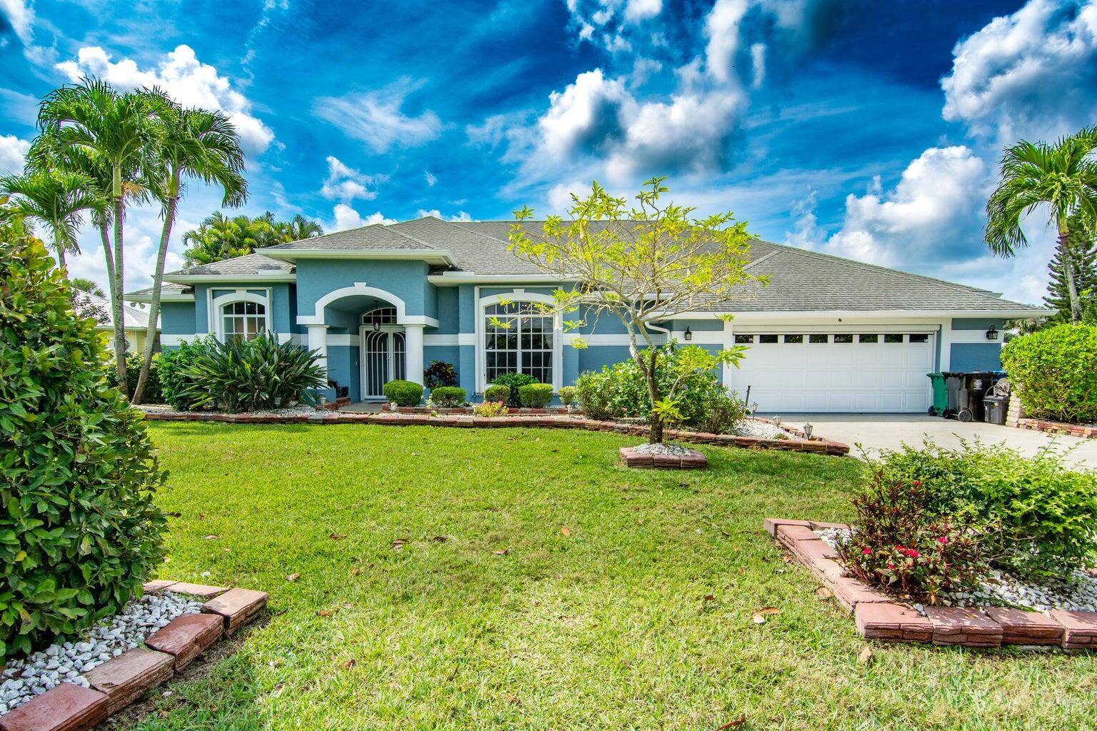 Beautiful 4 bedroom waterfront, pool home with 2 master suites, in Private Gated Community, is a GEM !