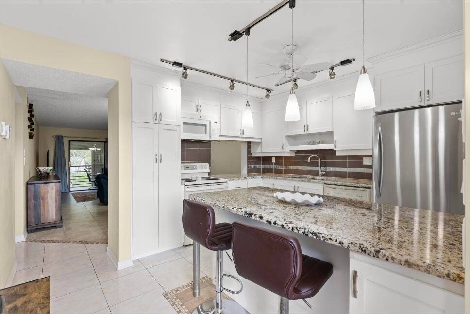 Welcome to your new home, desirable 55 Lakes of Carriage Hills in Tamarac !