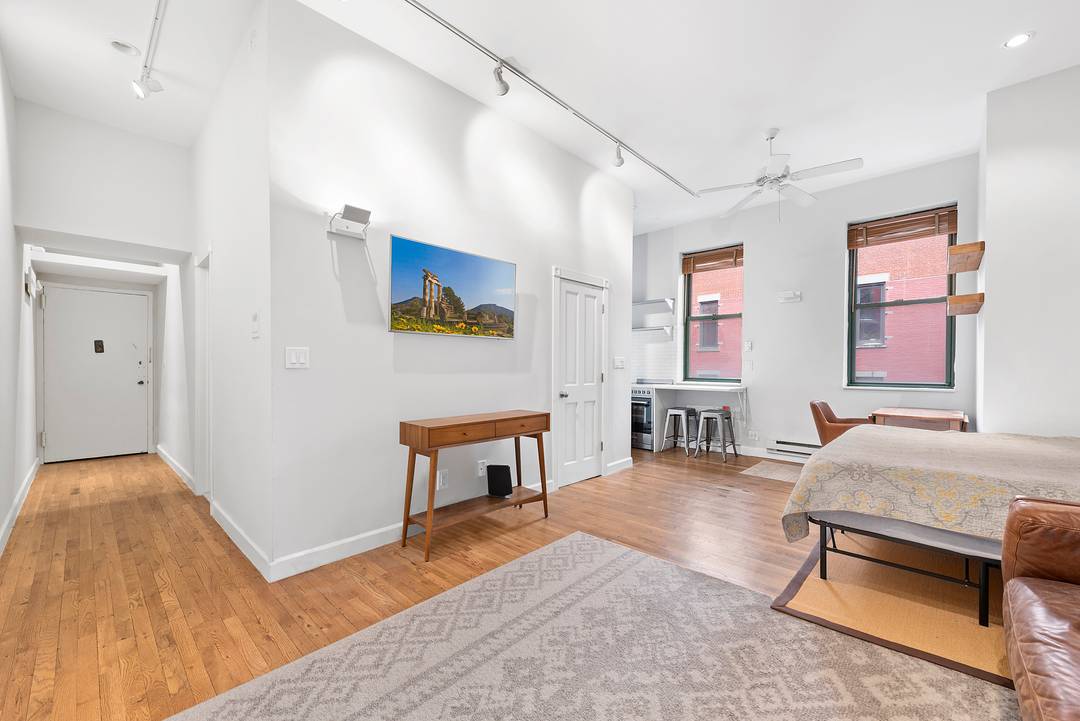 Residence 5B is a spacious studio with approximately 13 foot lofted ceilings, offering the volume and character rarely found in downtown rentals.