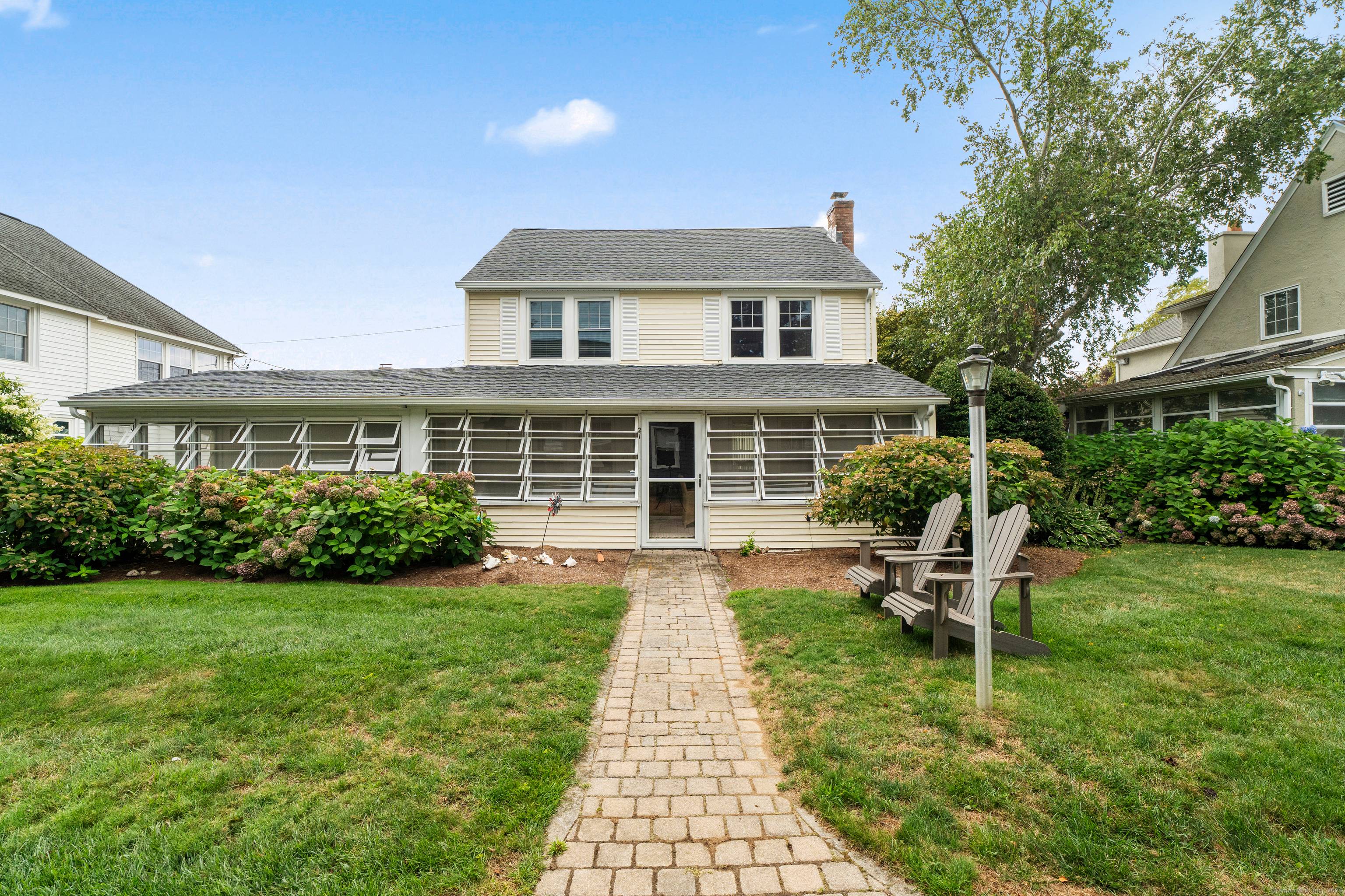 Welcome to 21 West Walk, where coastal living and timeless traditions come together.