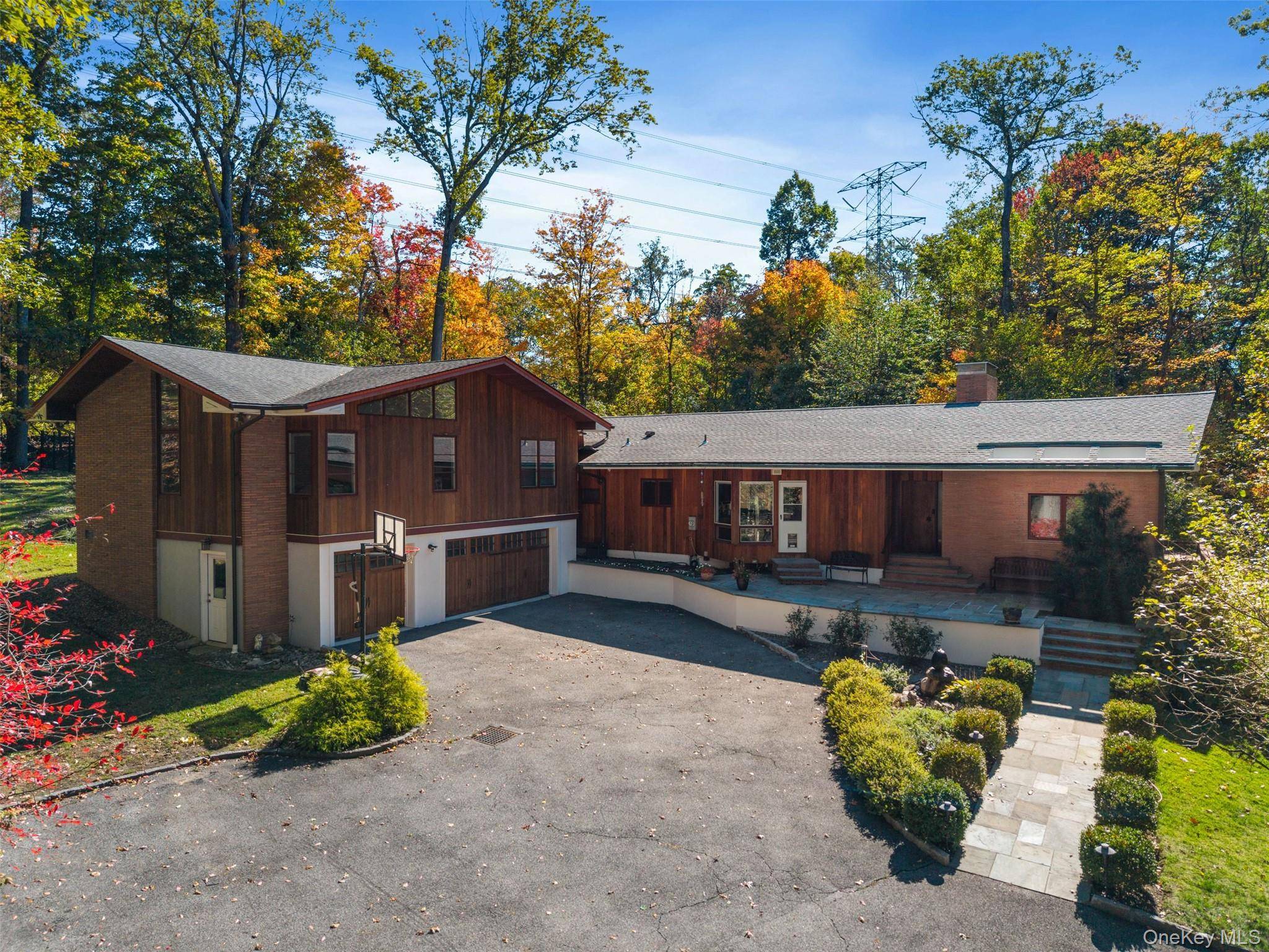 Welcome to 52 Sprain Valley Road, a private suburban retreat in the coveted Edgemont School District.