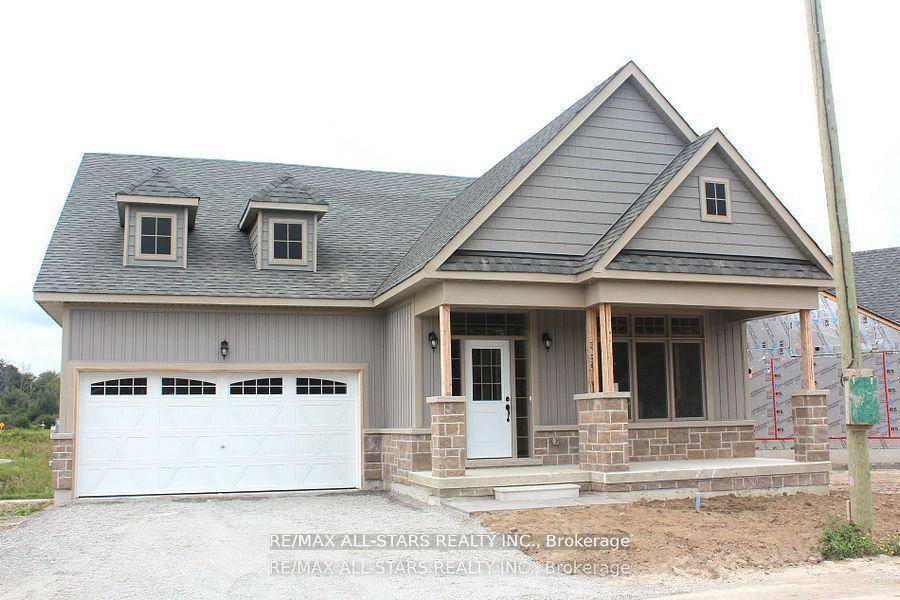 Inventory home presently under construction, The Raine's Model Elevation B with lot 2369 sq ft, with forested walking trails.