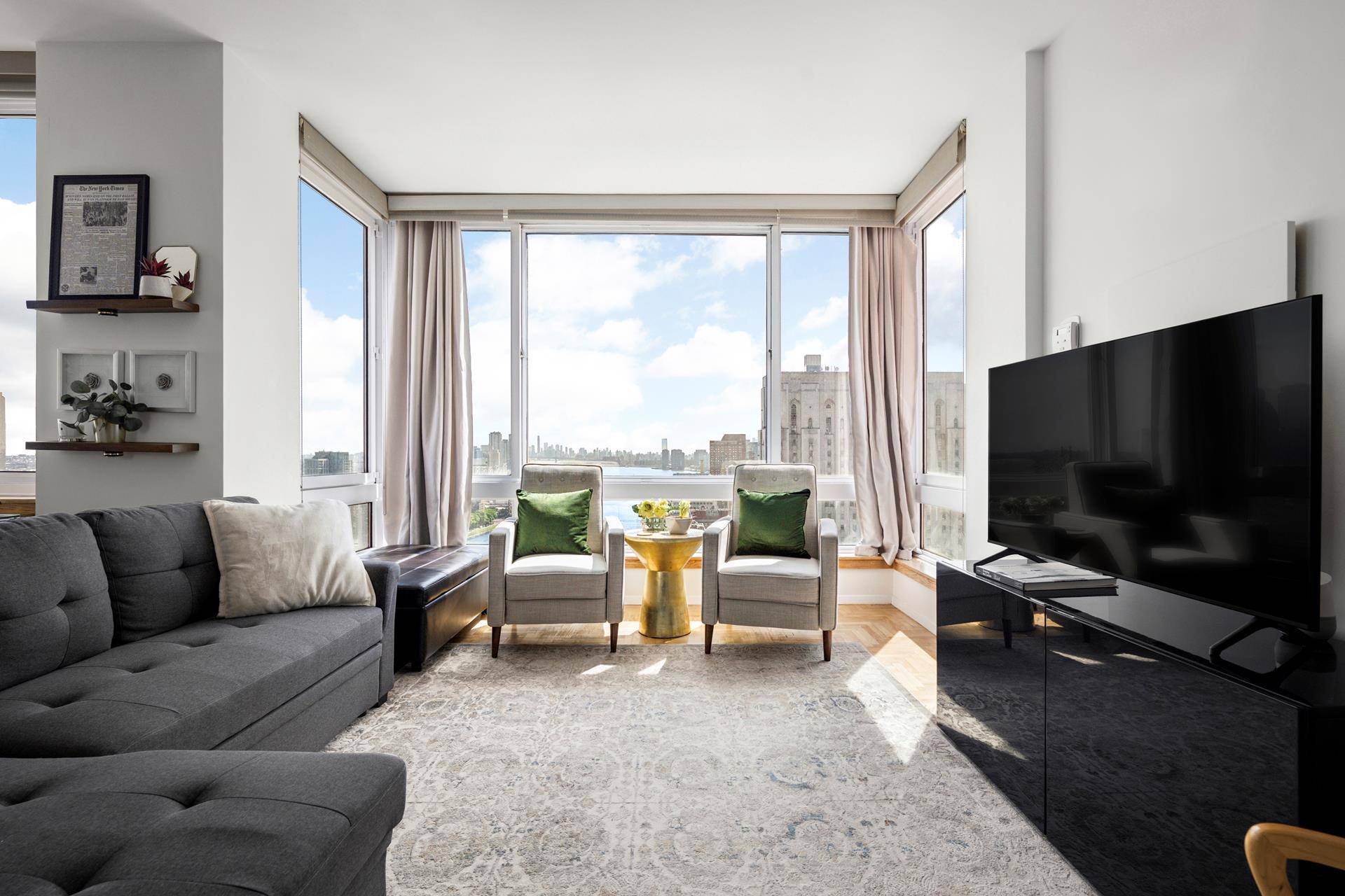 Enjoy sun filled living and sweeping East River views in this oversized 1 bedroom, 2 bathroom home at The Belaire Condominium.