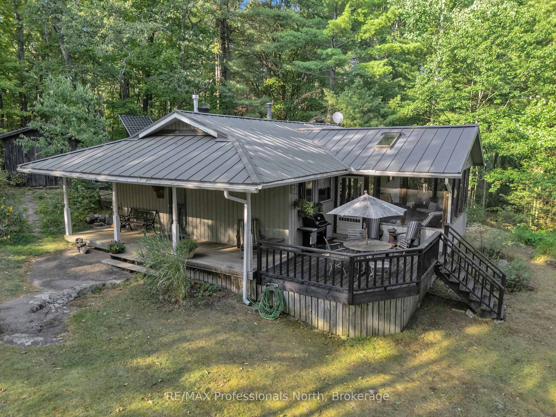 Sit in the Muskoka Room, deck or covered porch and listen to the Loons calling, waves lapping the shore and the breeze russling through the trees this is Off Grid ...
