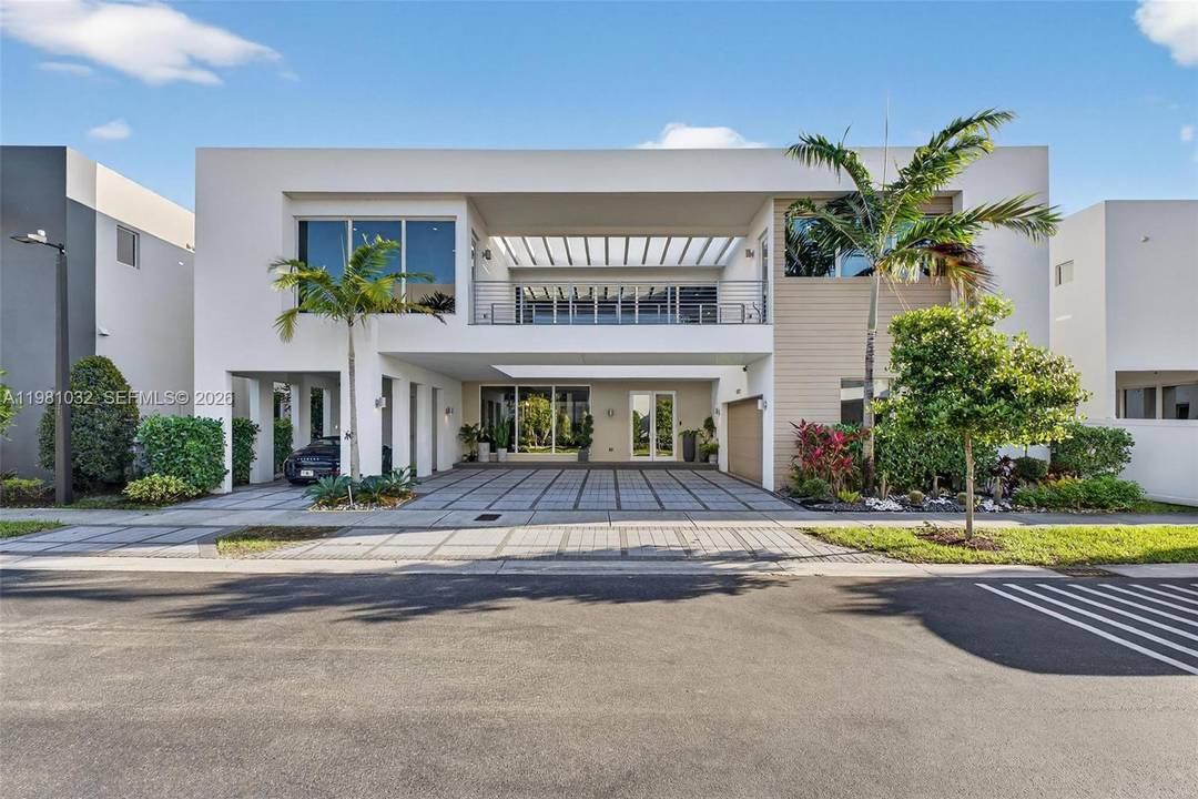Stunning lakefront residence located in the located in the exclusive gated community of Modern Doral.