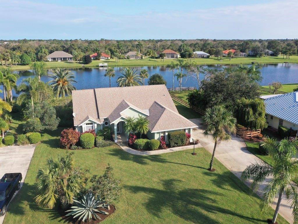 CUSTOM POOL HOME WITH COVETED EAST EXPOSURE LAKE VIEW.