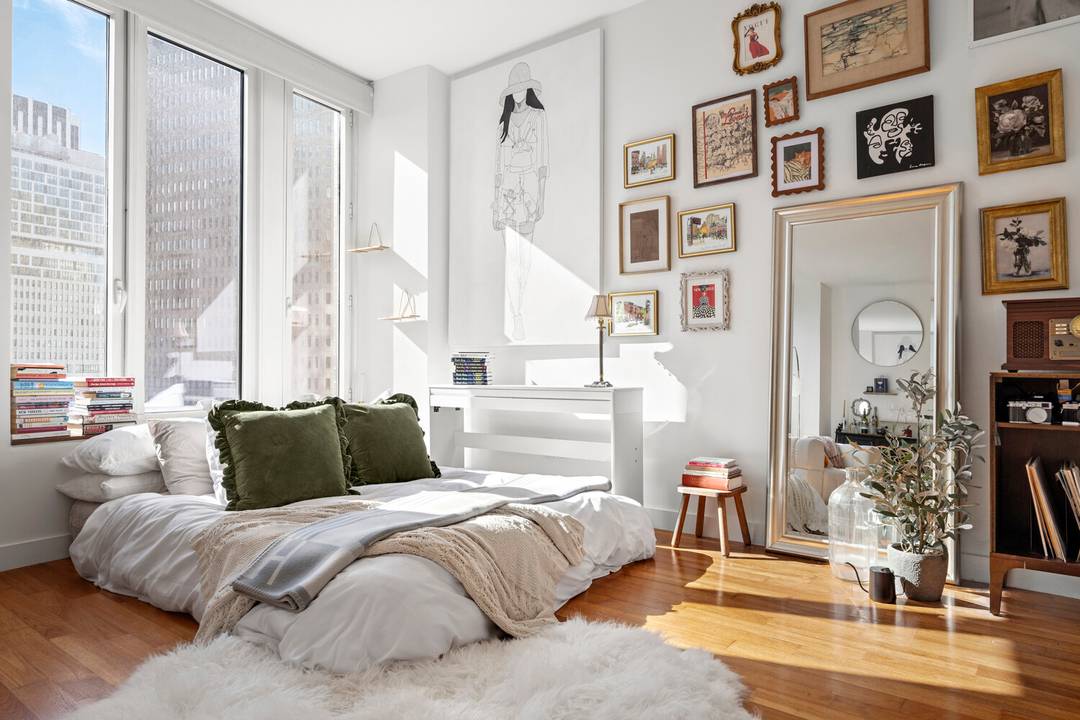 Bathed in light and beautifully proportioned, Residence 18D at 15 William Street is a spacious 698 sq ft studio framed by oversized windows with sweeping open views of the river ...