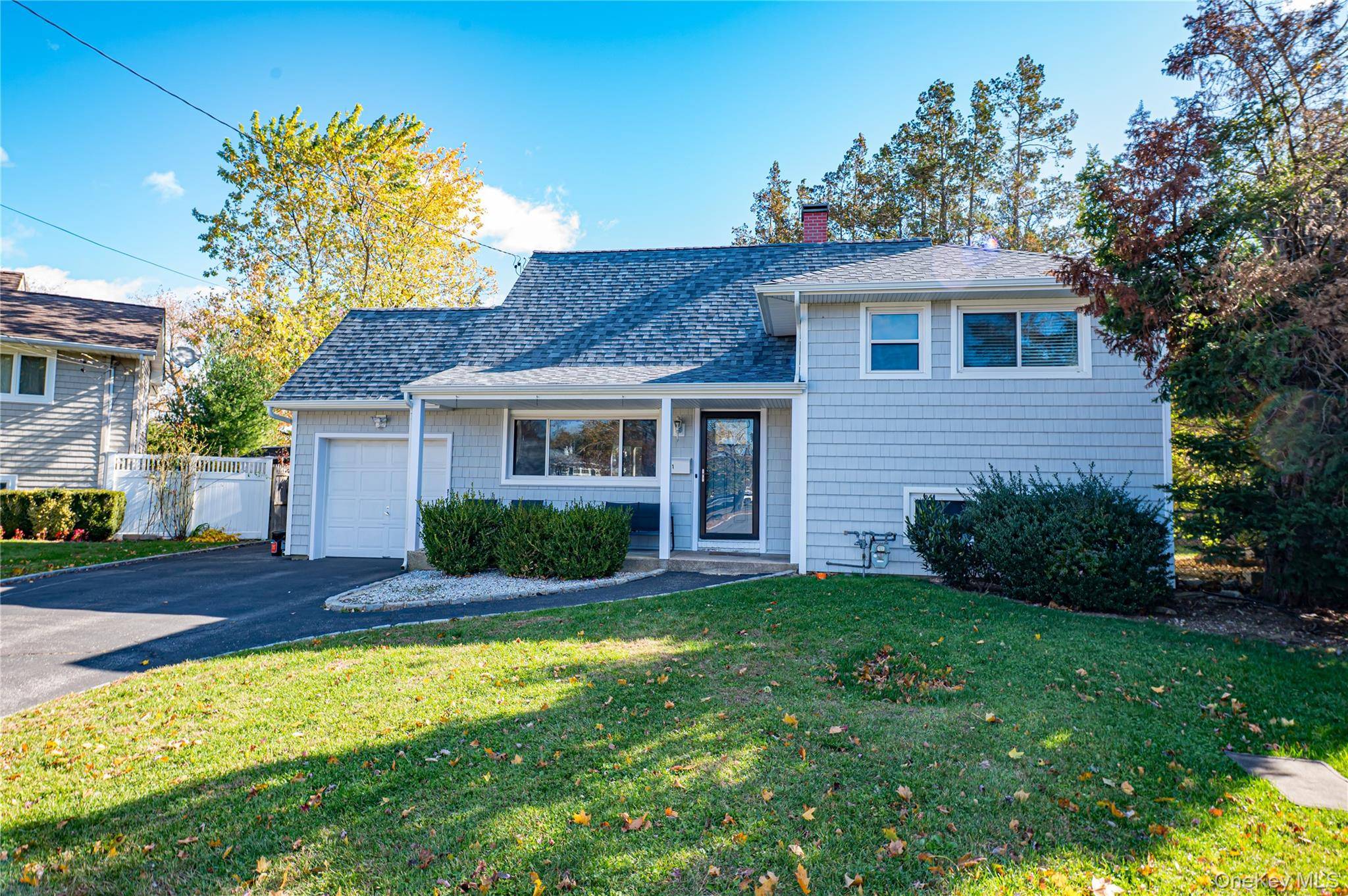 Welcome to this lovely expanded Split Level home, perfectly nestled on a peaceful cul de sac within the Commack School District.