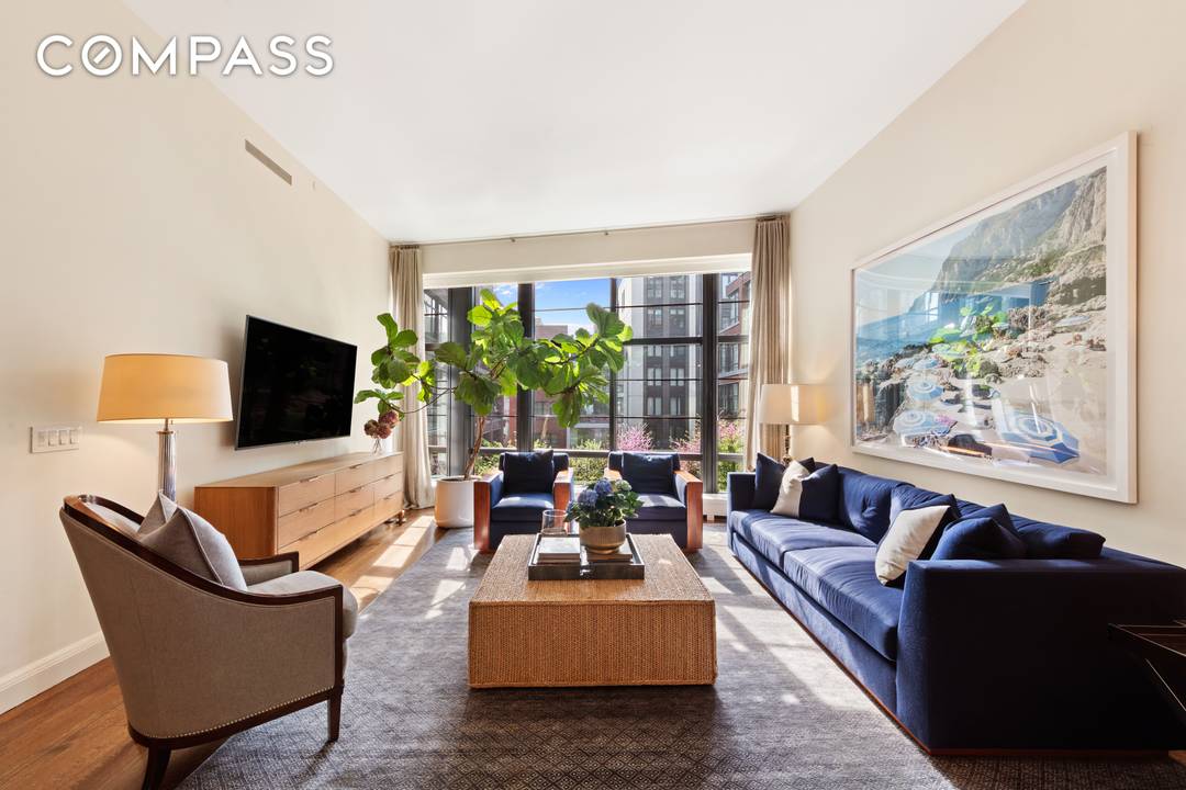 A private elevator opens into a grand foyer, leading to an oversized great room with floor to ceiling windows.