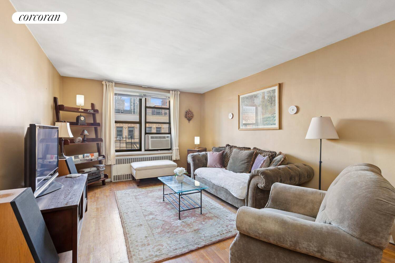 Upon entering, you're greeted by large north facing windows that fill the home with natural light, setting the stage for a bright and welcoming environment.