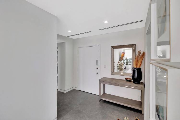 Welcome to your dream oceanfront lower penthouse condo, where modern luxury meets coastal living.