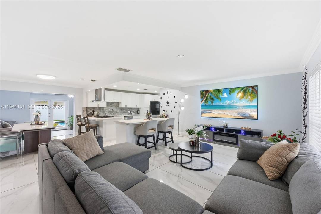 Welcome to this beautifully renovated 4 bedroom, 2 bath pool home, designed for effortless Florida living.