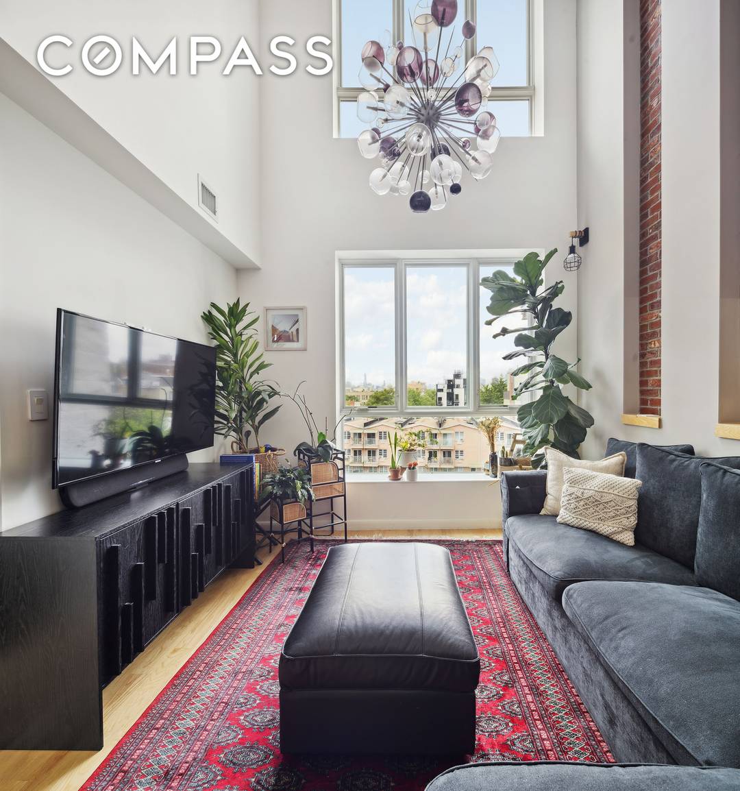 Top floor duplex in a boutique 2017 building, offering soaring double height ceilings and a rare deeded corner roof deck with sweeping skyline views.