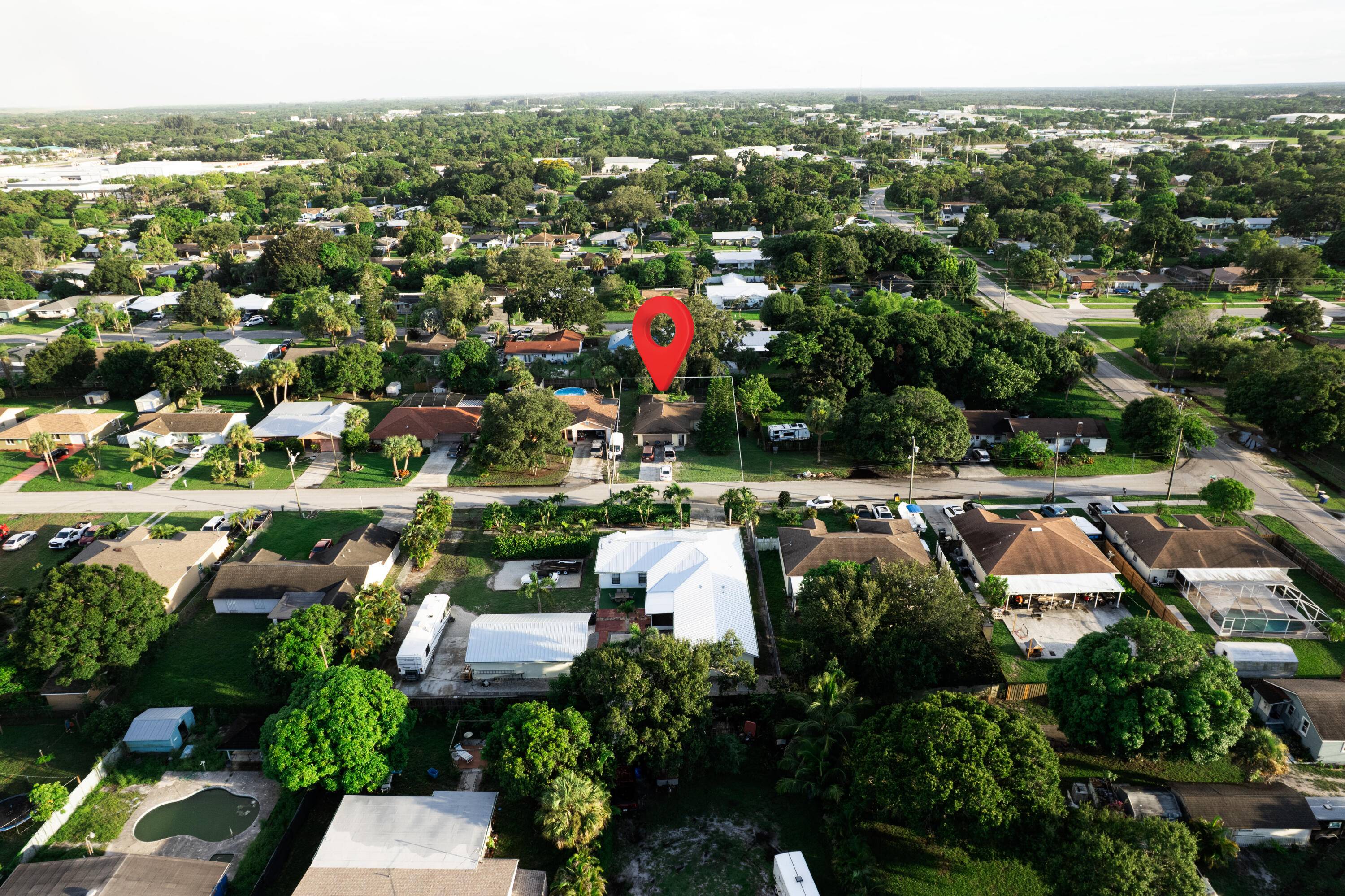 Dive into potential with this three bed, two bath home with a 2 car garage !
