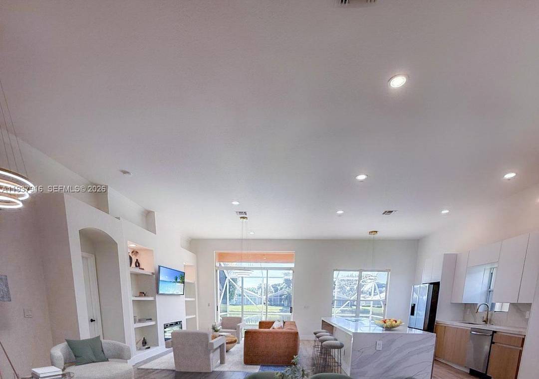 Beautifully renovated single family home in the highly sought after Villa Borghese 55 community.