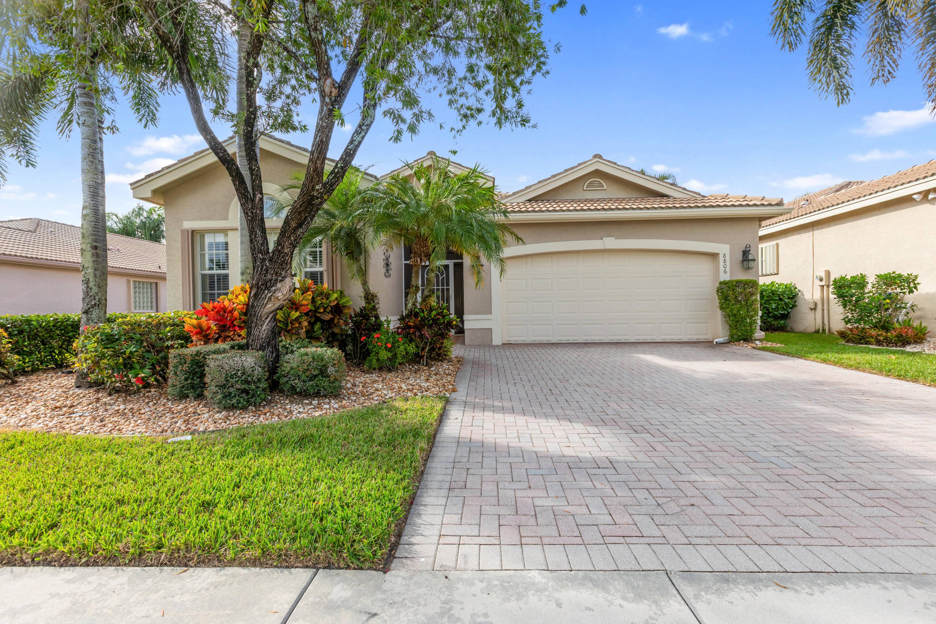 Welcome to this meticulously maintained 3 bedroom, 2 bathroom home with a spacious 2 car garage, located in the highly sought after Valencia Shores community of Lake Worth.