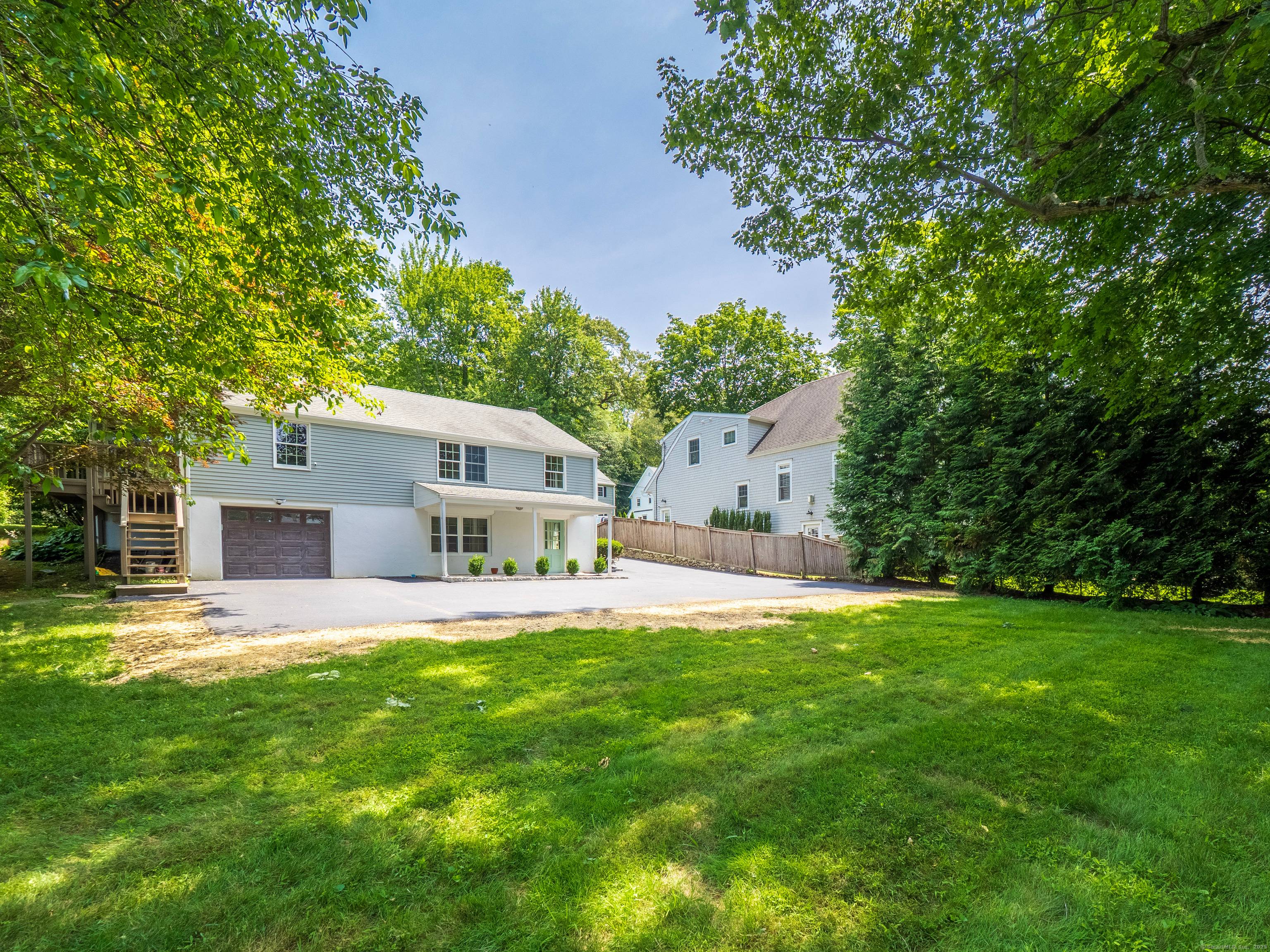Year Round Rental in Noroton Heights This stylish three bedroom two bathroom home has a sun filled living room with fireplace and a large picture window.