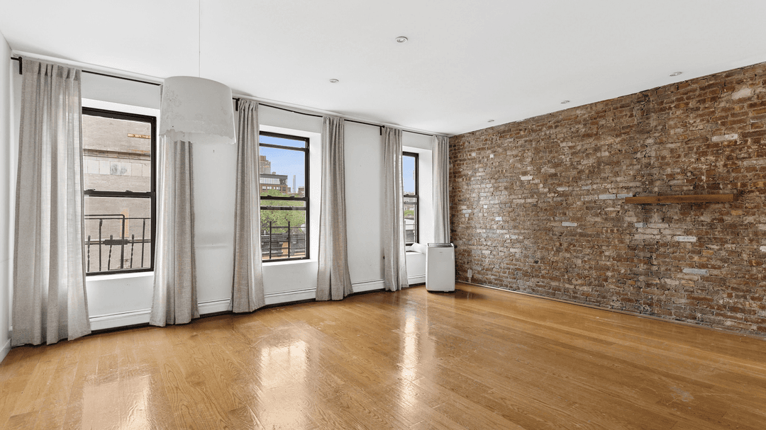 This lovely top floor two bedroom, plus office space, is a rare beauty !