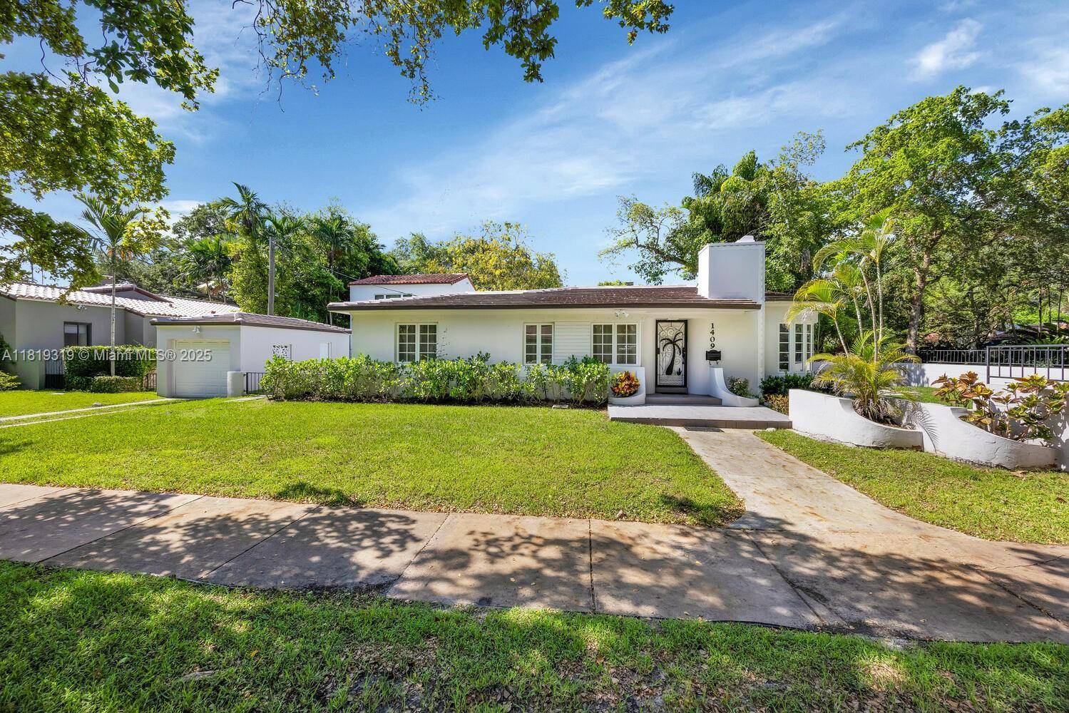 An exquisite 2 bedroom, 2 bathroom Art Deco residence in Coral Gables showcases an inviting open floor plan with original architectural details, including a charming fireplace with a stone mantle ...