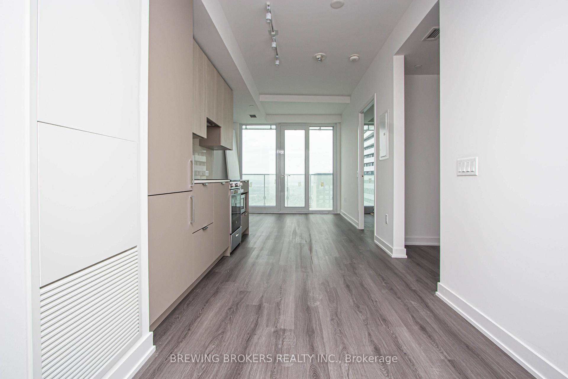 Imagine waking up high above the city on the 50th floor, sipping your morning coffee as the sun spills across the skyline from your private 98 sq ft balcony.