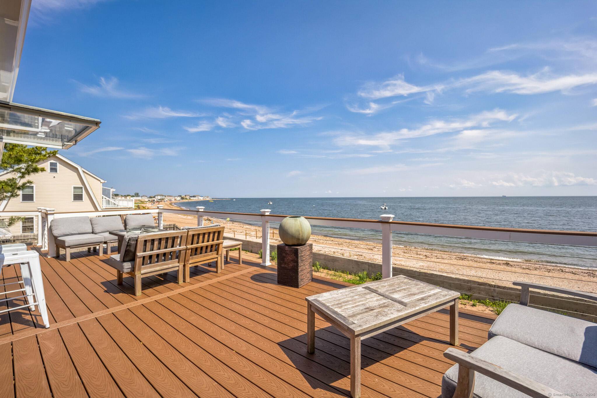 Waterfront on Morgan Point with 125' of private sandy beach, southeast exposure, and panoramic views of Long Island Sound.