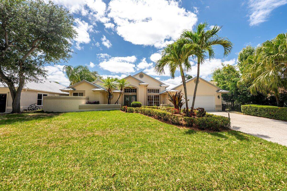 Spectacular custom pool home in one of Palm City's most sought after gated neighborhoods Harbour Pointe.