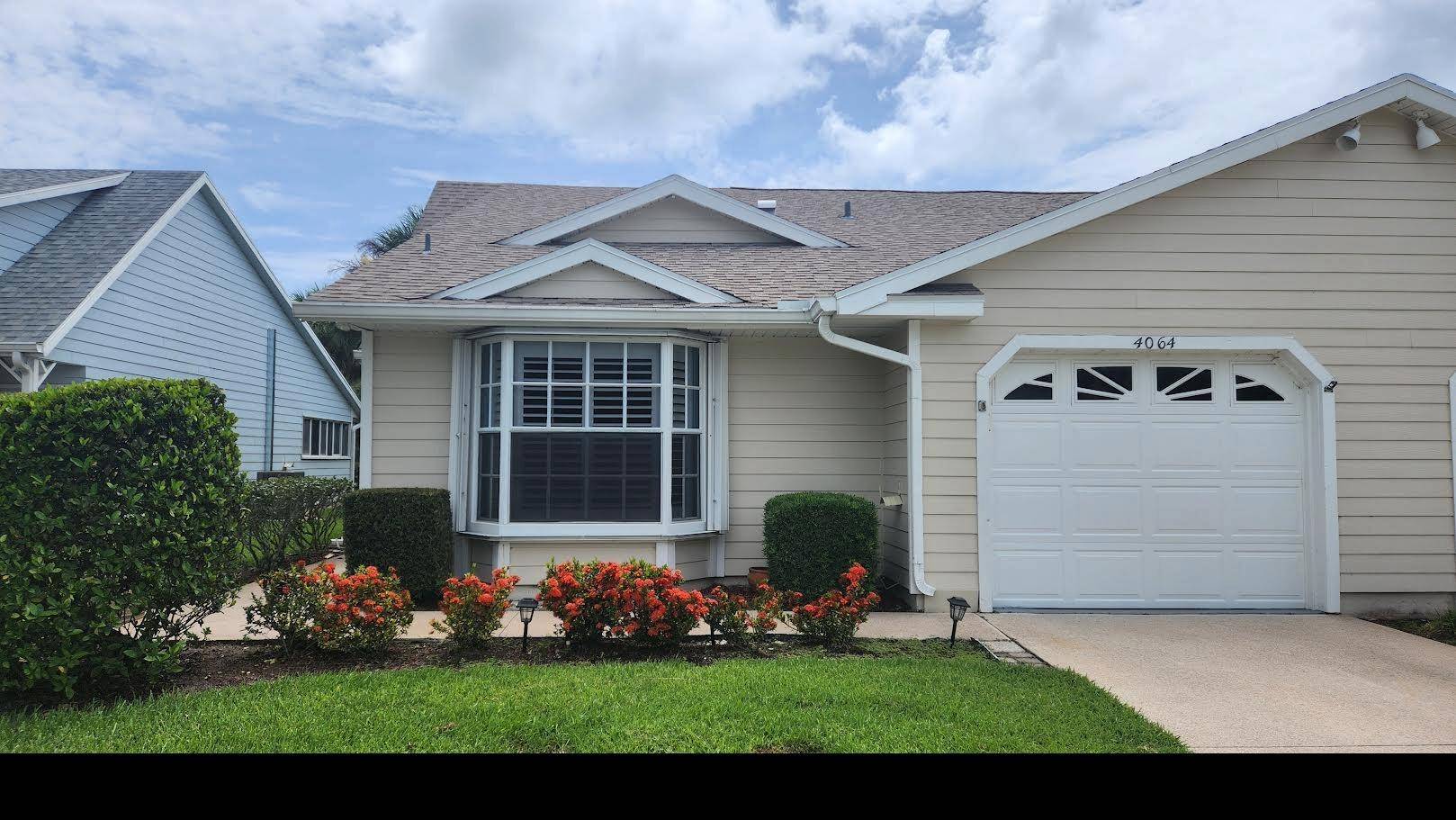 COME SEE THIS FANTASTIC GOLF VILLA WITH NEW A C, NEW REFRIGERATOR, NEW RANGE, NEW DISHWASHER, NEW LUXURY VINYL PLANK THROUGHOUT, PLANTATION SHUTTERS AND NEW MAIN BATHROOM SHOWER TILE GLASS.
