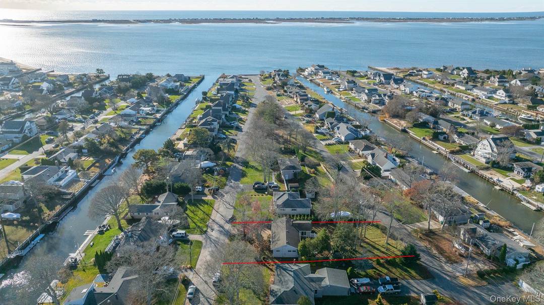 Nestled in the private boating and beach community of Shinnecock Shores, this charming 2 bedroom, 1 bath East Quogue ranch offers the perfect blend of tranquility and potential.