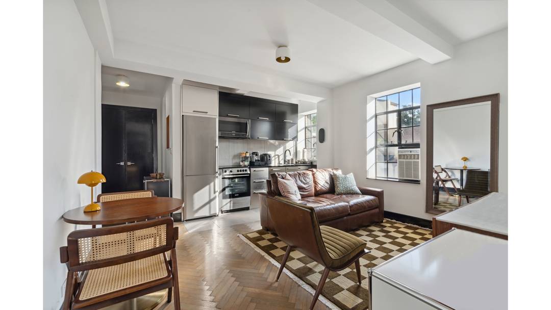 Welcome to your new home at 25 Monroe Place, where modern convenience meets classic charm.