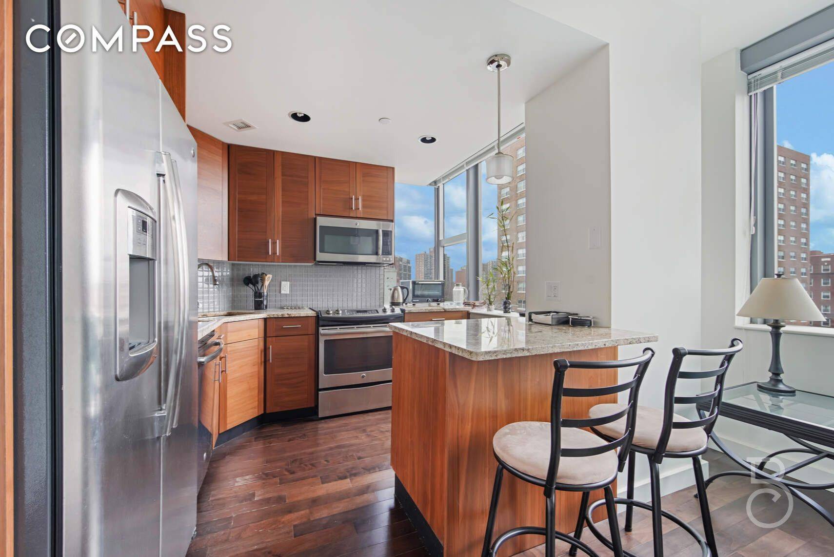 Enjoy the serenity of open sky views from this beautifully appointed one bedroom residence at The Aston, Forest Hills premier luxury condominium.