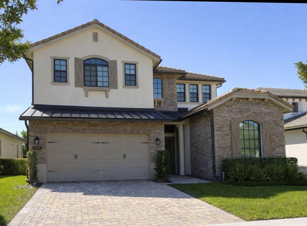 Modern waterfront living in the gated community of Palm Meadows.