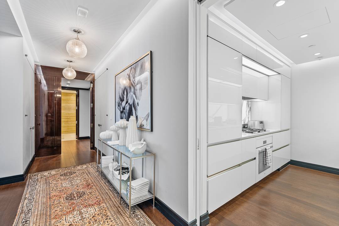 Enter into the resplendent embrace of Apartment 20C at 53 West 53rd Street, where the essence of timeless elegance intertwines with the pinnacle of modern luxury.