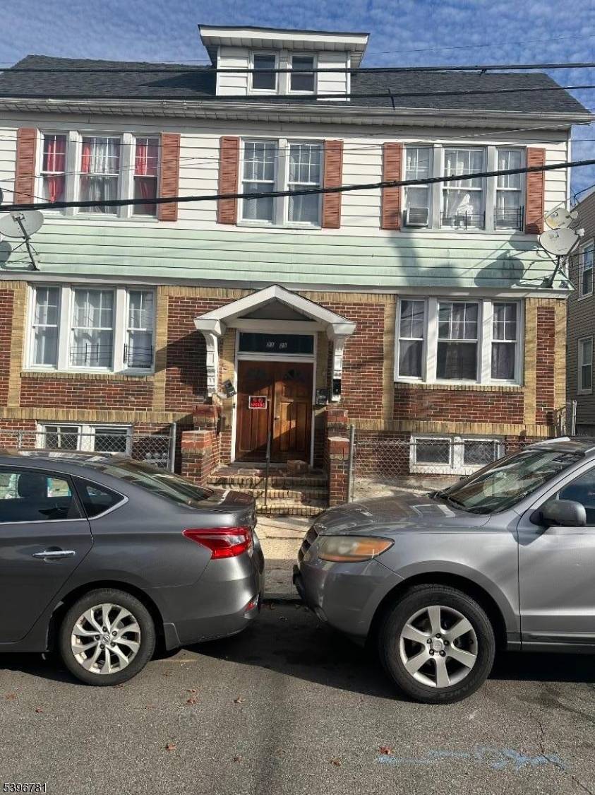 Four family Dwellings used as two bedrooms, living room, eat in kitchen and the 4th apartment has an extra sunroom, four gas furnaces, 2 cars detached garage used as storage ...