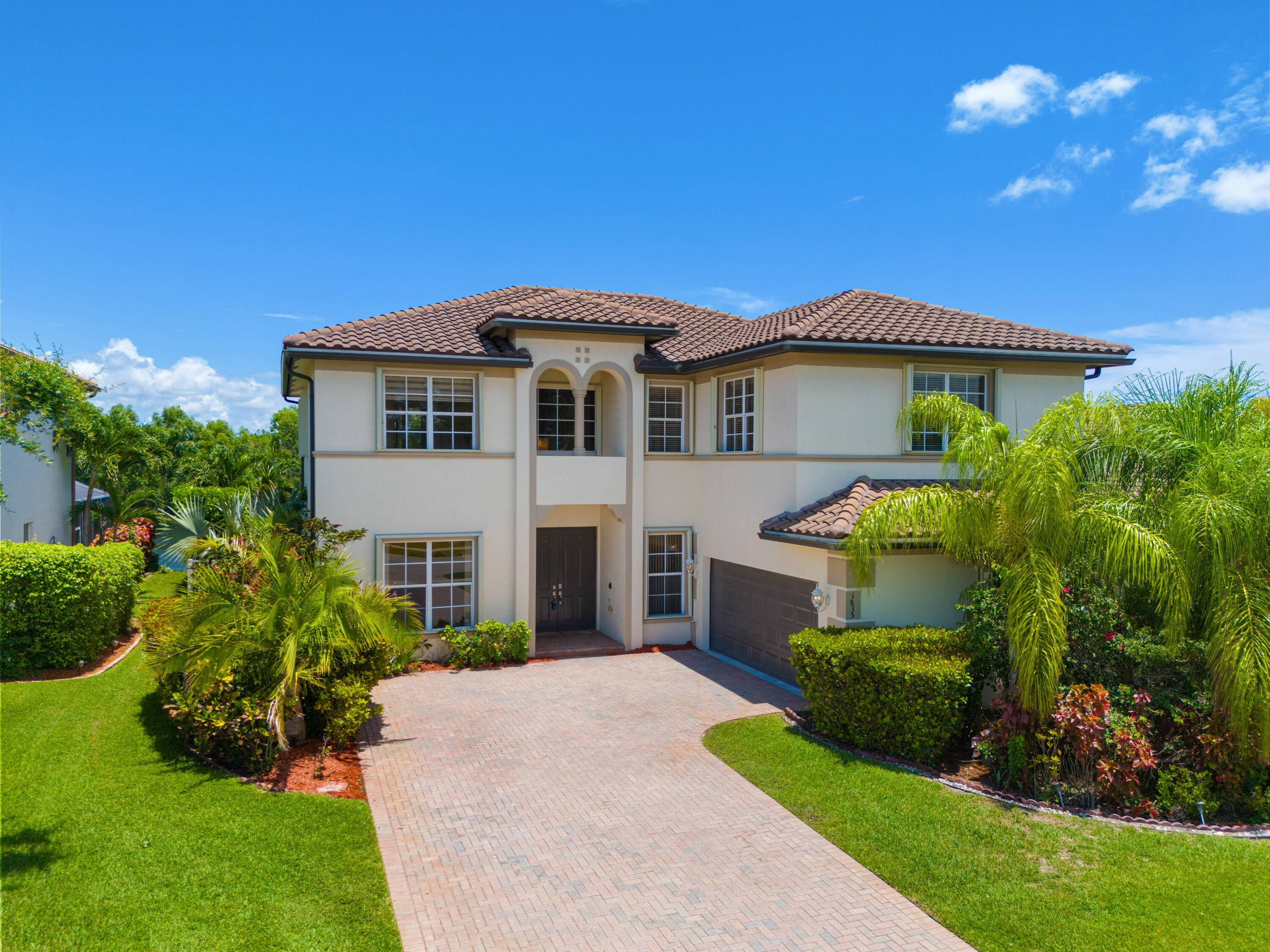 Nestled within the gated enclave of Newport Isles, this two story, 3, 516 square foot residence will impress with extravagant lakefront and pool views.