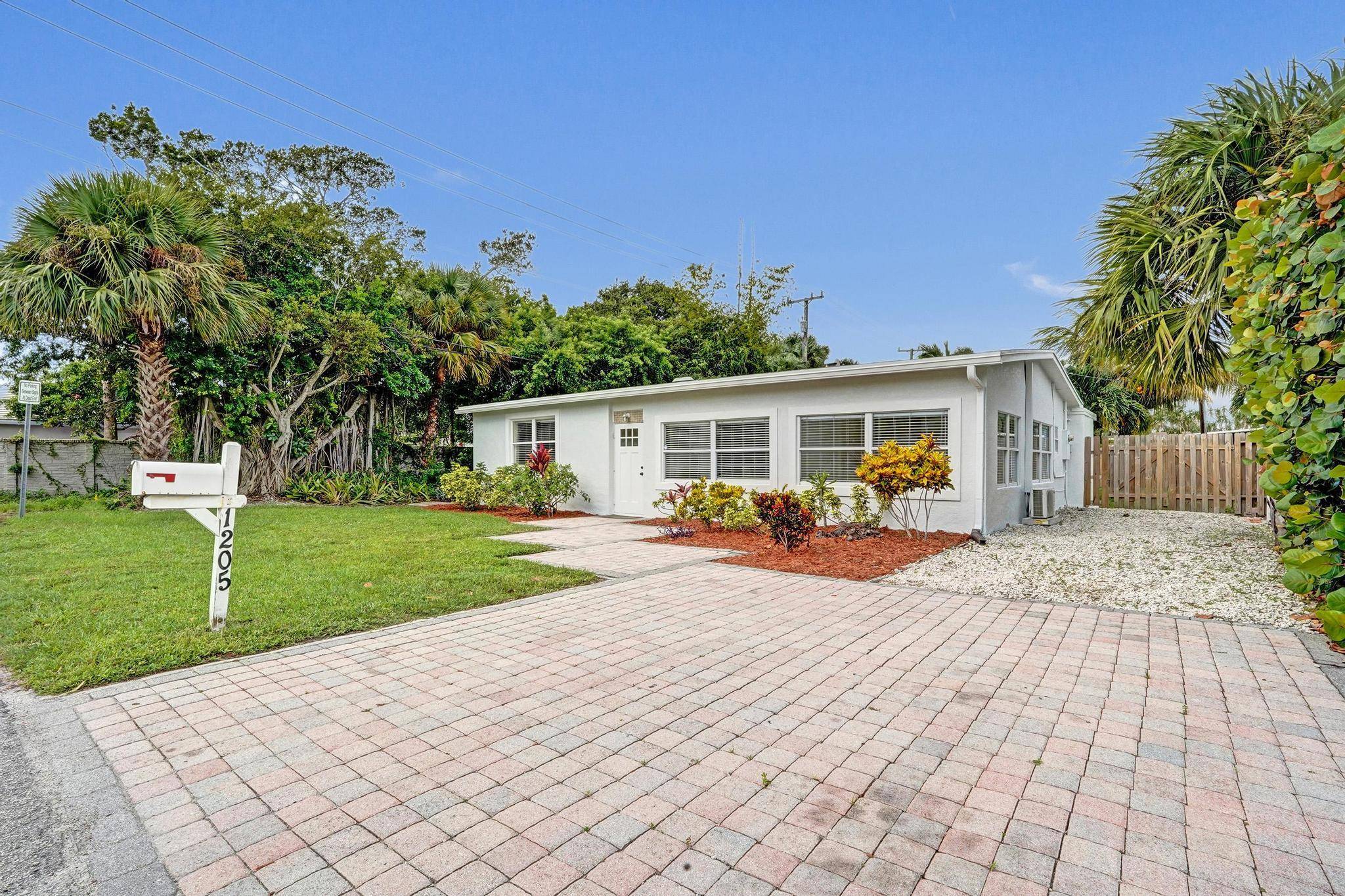 Discover this charming 3 bedroom, 2 bath home tucked away on a quiet dead end street in the desirable Lantana Cove neighborhood east of Federal Highway.