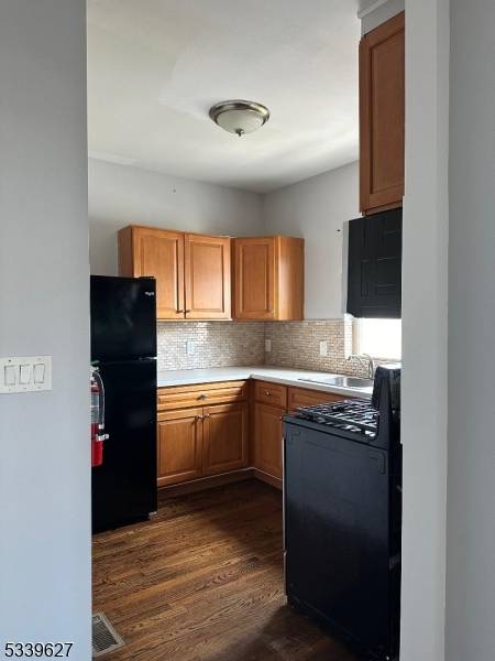 Investment opportunity ! Centrally located, completely updated in 2016, mixed use building 4A zoning with 4 apartments, store and 3 attached garages.