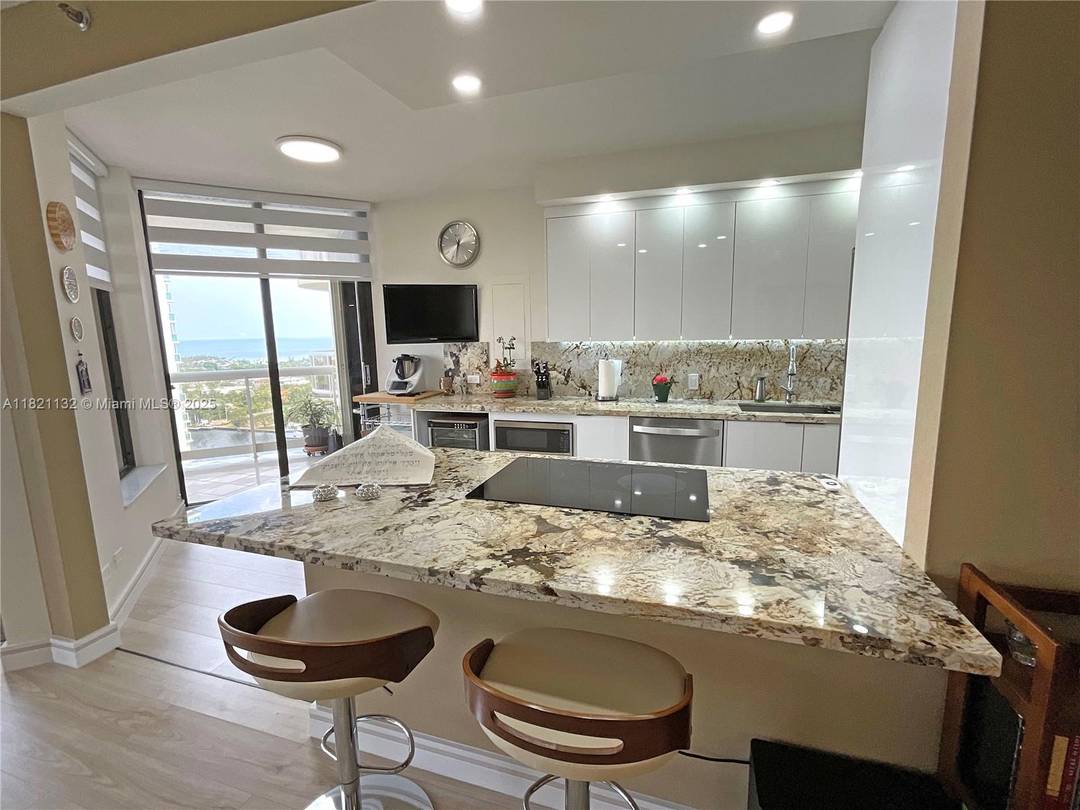 This is your place to be in the heart of Aventura no with a substantial price reduction.